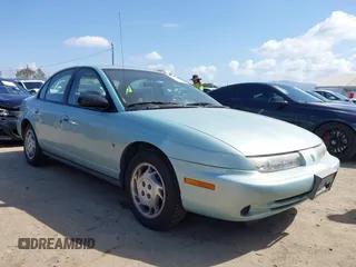 1997 Saturn SL z VIN 1G8ZJ5274VZ215955, wystawiony jako IAAI lot #41910429 z przebiegiem 121 172 mil mil oraz . Historia ofert i sprzedaży dostępna na DreamBid. Obrazek 1.
