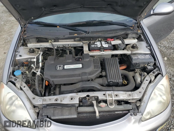 2005 Honda Insight z VIN JHMZE14715S000475, wystawiony jako Copart lot #80165654 z przebiegiem 154 667 mil mil oraz Czysty tytuł • Clean title. Historia ofert i sprzedaży dostępna na DreamBid. Obrazek 11.