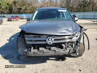2016 Volkswagen Tiguan S with VIN WVGBV7AX0GW524346, listed as a Copart auction lot 87221564 with 163,609 mi miles and Salvage Title. Bid and sale history available at DreamBid. Image 5.