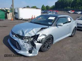 2014 Scion tC with VIN JTKJF5C78E3072572, listed as a IAAI auction lot 39680670 with 112,584 mi miles. Bid and sale history available at carsss.com. Image 2.