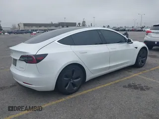 2020 Tesla Model 3 Long Range with VIN 5YJ3E1EB0LF803217, listed as a IAAI auction lot 41871940 with 130,391 mi miles. Bid and sale history available at carsss.com. Image 4.