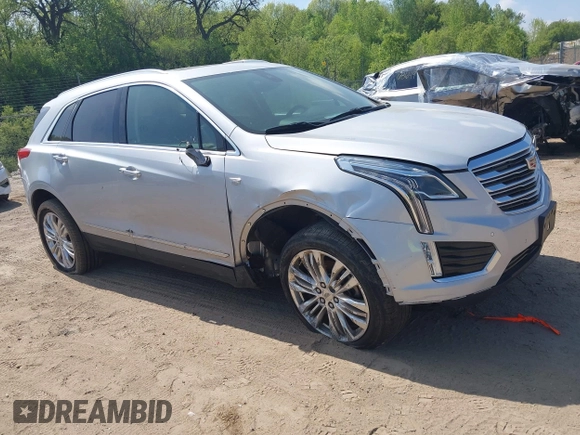 2017 Cadillac XT5 Premium Luxury AWD z VIN 1GYKNERS6HZ112170, wystawiony jako IAAI lot #42262116 z przebiegiem 140 982 mil mil oraz . Historia ofert i sprzedaży dostępna na DreamBid. Obrazek 1.
