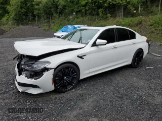 2018 BMW M5 z VIN WBSJF0C52JB283929, wystawiony jako Copart lot #57764965 z przebiegiem Nie podano mil oraz Szkoda całkowita • Salvage title. Historia ofert i sprzedaży dostępna na DreamBid. Obrazek 1.