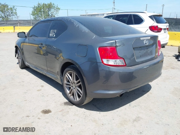 2011 Scion tC with VIN JTKJF5C72B3015652, listed as a IAAI auction lot 42087995 with 175,768 mi miles. Bid and sale history available at carsss.com. Image 3.