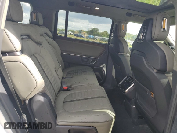 2023 Rivian R1S Adventure z VIN 7PDSGABA3PN024458, wystawiony jako Copart lot #74087714 z przebiegiem 3 505 mil mil oraz Nie do naprawy • Non repairable. Historia ofert i sprzedaży dostępna na DreamBid. Obrazek 11.