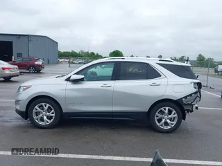 2021 Chevrolet Equinox Premier with VIN 3GNAXNEV4MS153066, listed as a IAAI auction lot 42413071 with 43,052 mi miles and . Bid and sale history available at DreamBid. Image 15.