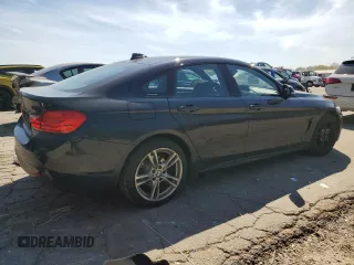 2015 BMW 4 Series 428i xDrive with VIN WBA4A7C58FD413734, listed as a Copart auction lot 50252325 with 74,629 mi miles and Salvage title. Bid and sale history available at DreamBid. Image 3.
