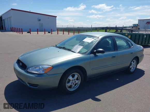 2005 Ford Taurus SE with VIN 1FAFP53U05A273576, listed as a IAAI auction lot 42140404 with 58,735 mi miles. Bid and sale history available at carsss.com. Image 2.