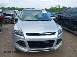 2016 Ford Escape Titanium with VIN 1FMCU9J95GUB93585, listed as a IAAI auction lot 42614106 with 124,465 mi miles and . Bid and sale history available at DreamBid. Image 12.