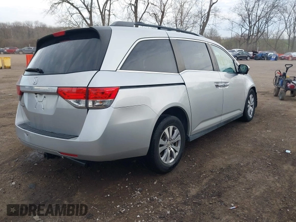 2014 Honda Odyssey EX-L with VIN 5FNRL5H65EB096544, listed as a IAAI auction lot 41903451 with 99,628 mi miles and . Bid and sale history available at carsss.com. Image 4.