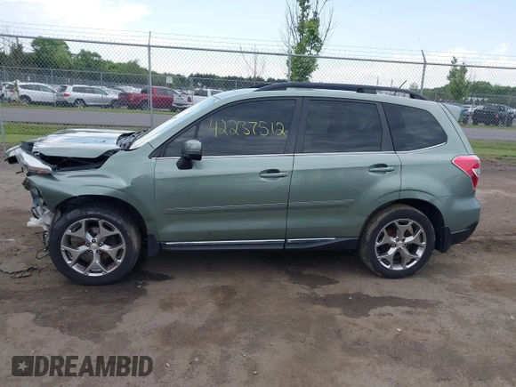2015 Subaru Forester Touring with VIN JF2SJAWC9FH561581, listed as a IAAI auction lot 42237512 with 109,210 mi miles and . Bid and sale history available at DreamBid. Image 14.