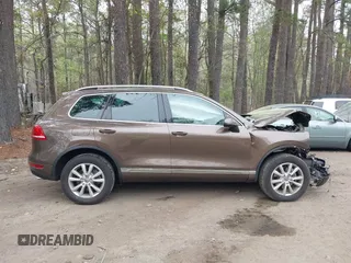 2014 Volkswagen Touareg Sport with VIN WVGEF9BP2ED007904, listed as a IAAI auction lot 41960811 with 126,230 mi miles and . Bid and sale history available at DreamBid. Image 13.