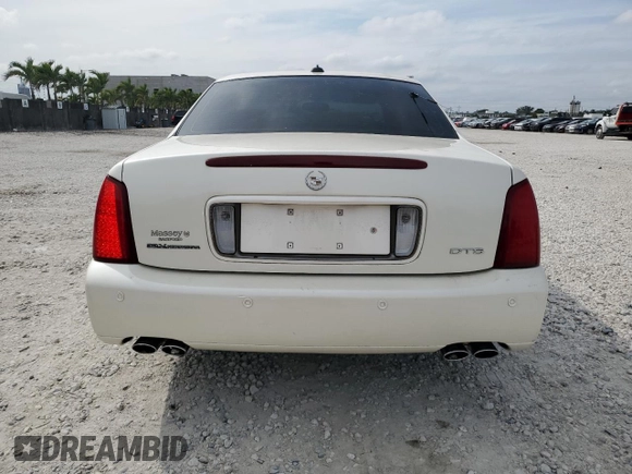 2003 Cadillac DeVille DTS z VIN 1G6KF57973U204531, wystawiony jako Copart lot #45712115 z przebiegiem 107 737 mil mil oraz Szkoda całkowita • Salvage title. Historia ofert i sprzedaży dostępna na DreamBid. Obrazek 6.