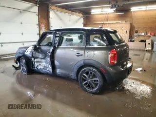 2014 MINI Countryman with VIN WMWZB3C59EWR42124, listed as a Copart auction lot 57830395 with 125,000 mi miles and Salvage title. Bid and sale history available at DreamBid. Image 2.