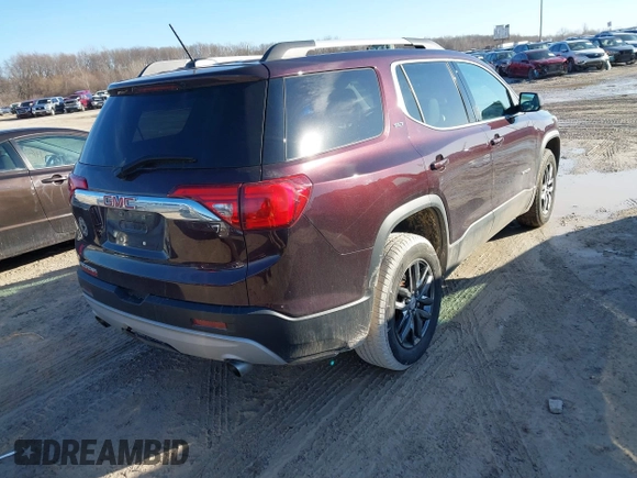 2017 GMC Acadia SLT with VIN 1GKKNMLS6HZ321860, listed as a IAAI auction lot 41679667 with 112,374 mi miles. Bid and sale history available at carsss.com. Image 4.