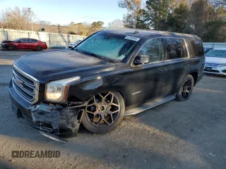 2015 GMC Yukon SLT with VIN 1GKS2BKC9FR307875, listed as a Copart auction lot 42309065 with 202,837 mi miles and Salvage Title. Bid and sale history available at carsss.com. Image 1.