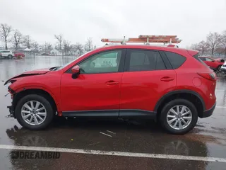 2015 Mazda CX-5 Touring with VIN JM3KE4CY3F0529669, listed as a IAAI auction lot 41866873 with 137,635 mi miles and . Bid and sale history available at carsss.com. Image 14.