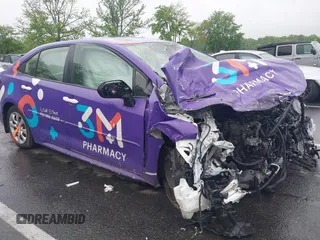 2023 Toyota Corolla LE z VIN JTDB4MEE5PJ007099, wystawiony jako IAAI lot #42230057 z przebiegiem 51 393 mil mil oraz . Historia ofert i sprzedaży dostępna na DreamBid. Obrazek 1.