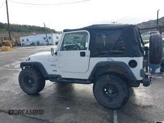 2001 Jeep Wrangler Sport with VIN 1J4FA49S41P308407, listed as a IAAI auction lot 41772240 with 139,461 mi miles. Bid and sale history available at carsss.com. Image 14.