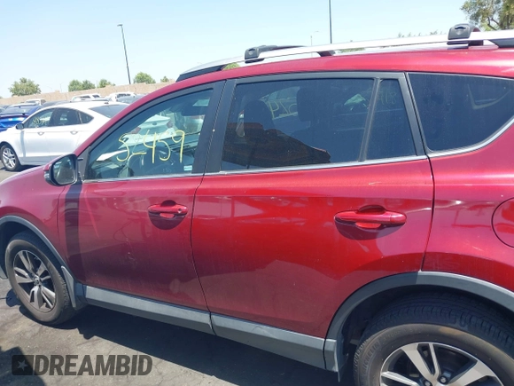 2018 Toyota RAV4 XLE with VIN 2T3WFREV4JW505053, listed as a IAAI auction lot 42552459 with 94,552 mi miles and . Bid and sale history available at DreamBid. Image 15.