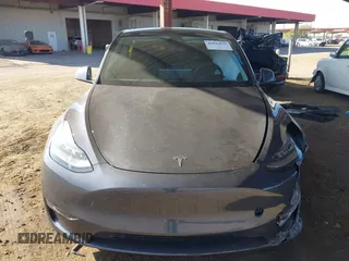 2022 Tesla Model Y Long Range with VIN 7SAYGDEE2NA017434, listed as a IAAI auction lot 41842025 with 35,164 mi miles and . Bid and sale history available at DreamBid. Image 12.