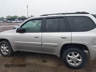2004 GMC Envoy SLT z VIN 1GKDT13S742130352, wystawiony jako IAAI lot #42355072 z przebiegiem 170 355 mil mil oraz . Historia ofert i sprzedaży dostępna na DreamBid. Obrazek 13.