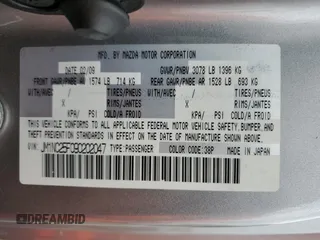 2009 Mazda MX-5 Miata Grand Touring z VIN JM1NC25F090202047, wystawiony jako Copart lot #55810505 z przebiegiem 91 618 mil mil oraz Szkody całkowita. Historia ofert i sprzedaży dostępna na DreamBid. Obrazek 12.