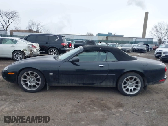 1997 Jaguar XK with VIN SAJGX274XVC017622, listed as a IAAI auction lot 41614339 with 94,298 mi miles and . Bid and sale history available at DreamBid. Image 13.