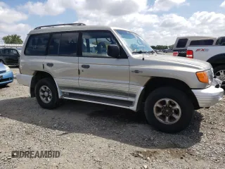 1998 Mitsubishi Montero z VIN JA4MR51RXWJ006418, wystawiony jako Copart lot #54878275 z przebiegiem 225 110 mil mil oraz Szkoda całkowita • Salvage title. Historia ofert i sprzedaży dostępna na DreamBid. Obrazek 4.