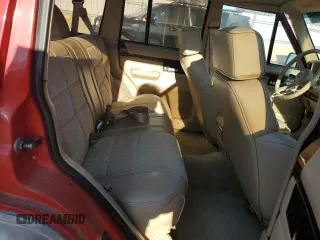 1993 Jeep Cherokee z VIN 1J4FT78S9PL634409, wystawiony jako Copart lot #77034984 z przebiegiem 146 585 mil mil oraz Szkoda całkowita • Salvage title. Historia ofert i sprzedaży dostępna na DreamBid. Obrazek 10.