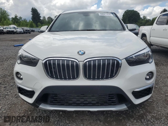 2018 BMW X1 xDrive28i with VIN WBXHT3C35J5L29298, listed as a Copart auction lot 59041435 with 27,612 mi miles and Salvage title. Bid and sale history available at DreamBid. Image 5.