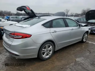 2018 Ford Fusion SE z VIN 3FA6P0H79JR270777, wystawiony jako Copart lot #45319755 z przebiegiem 69 152 mil mil oraz Szkoda całkowita • Salvage title. Historia ofert i sprzedaży dostępna na DreamBid. Obrazek 3.