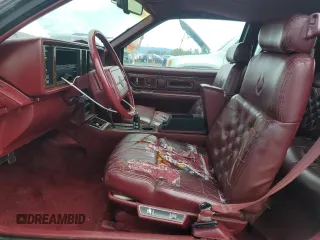 1991 Cadillac Eldorado z VIN 1G6EL13B9MU604115, wystawiony jako Copart lot #52232425 z przebiegiem 95 570 mil mil oraz Szkody całkowita. Historia ofert i sprzedaży dostępna na DreamBid. Obrazek 7.