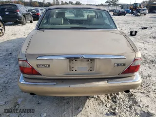 1998 Jaguar XJ with VIN SAJHX1242WC845736, listed as a Copart auction lot 82006044 with 188,785 mi miles and Salvage Title. Bid and sale history available at carsss.com. Image 6.