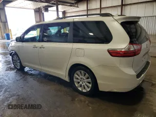2015 Toyota Sienna XLE with VIN 5TDYK3DC4FS688299, listed as a Copart auction lot 61793155 with 57,197 mi miles and Salvage title. Bid and sale history available at DreamBid. Image 2.