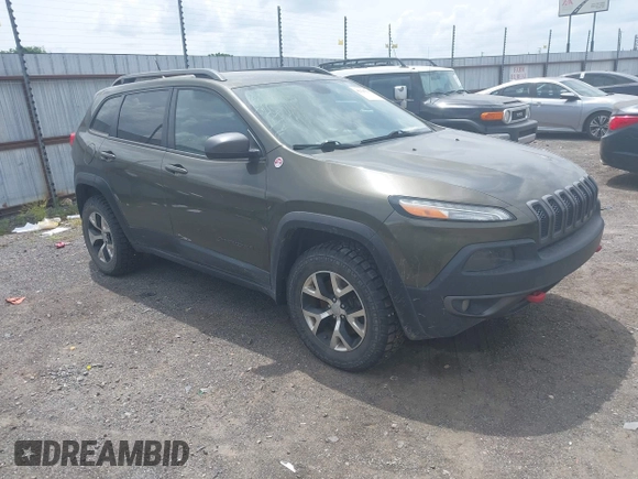 2014 Jeep Cherokee Trailhawk z VIN 1C4PJMBBXEW232210, wystawiony jako IAAI lot #42143917 z przebiegiem 113 603 mil mil oraz . Historia ofert i sprzedaży dostępna na DreamBid. Obrazek 1.