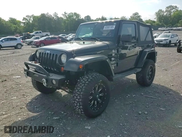 2011 Jeep Wrangler Sahara with VIN 1J4AA5D15BL552185, listed as a Copart auction lot 63065185 with 159,850 mi miles and Salvage title. Bid and sale history available at DreamBid. Image 13.