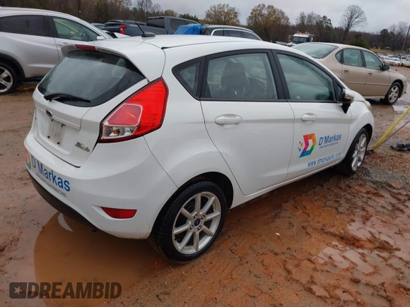 2016 Ford Fiesta SE with VIN 3FADP4EJ2GM157810, listed as a IAAI auction lot 41011326 with 214,609 mi miles. Bid and sale history available at carsss.com. Image 4.