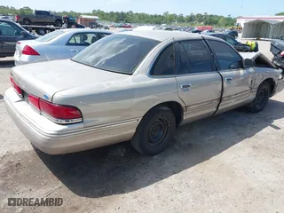 1995 Ford Crown Victoria with VIN 2FALP73W5SX140346, listed as a IAAI auction lot 41974429 with 166,540 mi miles. Bid and sale history available at carsss.com. Image 4.