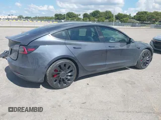 2022 Tesla Model 3 Performance with VIN 5YJ3E1EC9NF201184, listed as a IAAI auction lot 41534959 with 29,389 mi miles and . Bid and sale history available at DreamBid. Image 4.