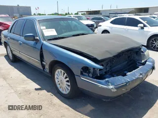 2009 Mercury Grand Marquis LS with VIN 2MEHM75V09X634393, listed as a IAAI auction lot 41993456 with 153,862 mi miles. Bid and sale history available at carsss.com. Image 1.