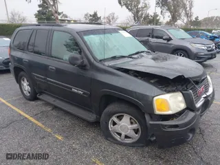 2003 GMC Envoy SLE with VIN 1GKDS13SX32371727, listed as a IAAI auction lot 41569398 with 86,395 mi miles. Bid and sale history available at carsss.com. Image 1.