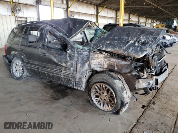 2002 Jeep Grand Cherokee Limited with VIN 1J8GX58N72C294837, listed as a Copart auction lot 56201145 with 218,345 mi miles and Salvage Title. Bid and sale history available at DreamBid. Image 4.