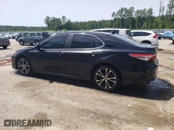 2018 Toyota Camry LE с VIN 4T1B11HKXJU656262, выставлен на аукционе Copart как лот 57132965 с пробегом 106 876 миль миль и Списание • Salvage title. История ставок и продаж доступна на DreamBid. Изображение 2.