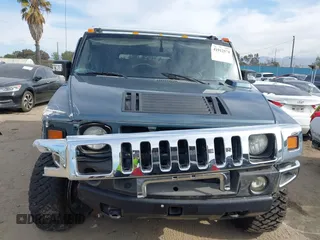 2005 Hummer H2 SUV with VIN 5GRGN23U35H105620, listed as a IAAI auction lot 41912574 with 232,938 mi miles. Bid and sale history available at carsss.com. Image 13.