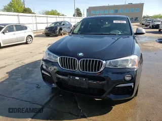 2018 BMW X4 M40i with VIN 5UXXW7C54J0Z44932, listed as a Copart auction lot 55973605 with 101,479 mi miles and Salvage title. Bid and sale history available at DreamBid. Image 14.