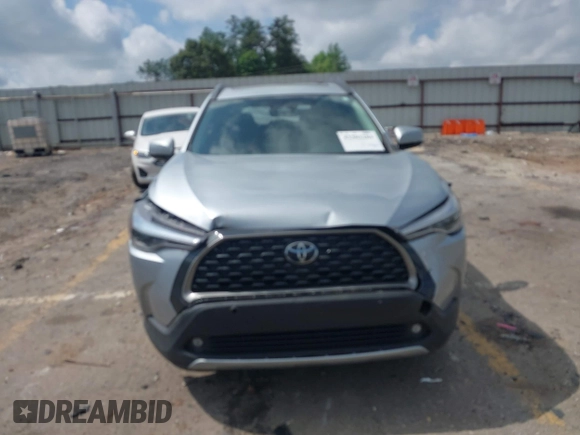 2023 Toyota Corolla Cross XLE with VIN 7MUDAAAG0PV057750, listed as a IAAI auction lot 42302284 with 31,404 mi miles and . Bid and sale history available at DreamBid. Image 12.