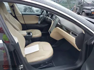 2013 Tesla Model S with VIN 5YJSA1DN9DFP03380, listed as a IAAI auction lot 41865213 with 184,831 mi miles. Bid and sale history available at carsss.com. Image 5.