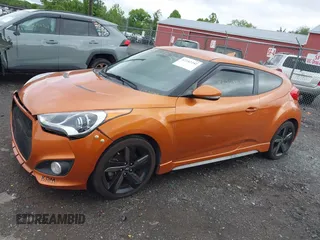 2013 Hyundai Veloster Turbo z VIN KMHTC6AE3DU124744, wystawiony jako IAAI lot #42242242 z przebiegiem 115 757 mil mil oraz . Historia ofert i sprzedaży dostępna na DreamBid. Obrazek 14.