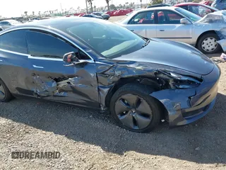 2020 Tesla Model 3 Standard Range Plus with VIN 5YJ3E1EA5LF644282, listed as a IAAI auction lot 41710124 with 69,969 mi miles and . Bid and sale history available at DreamBid. Image 6.